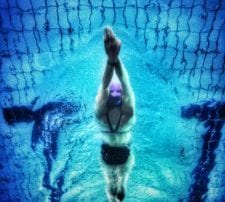 Woman swimming in lane