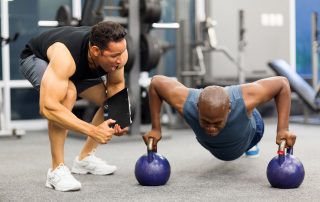training giving client motivation to workout at the gym