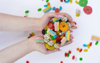 Handful of candy on white background